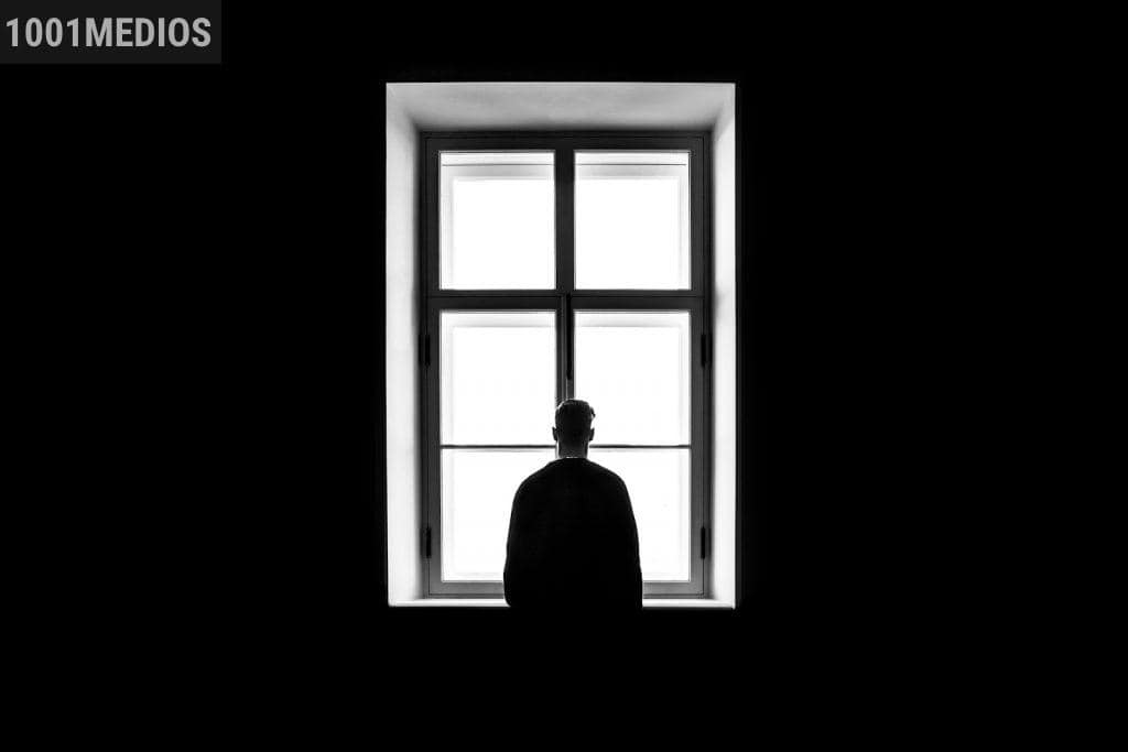 man standing in front of the window
