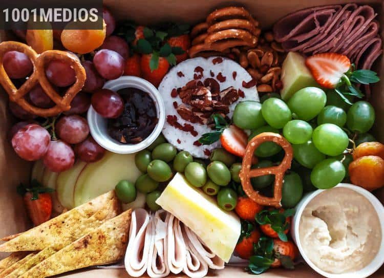 sliced vegetables and fruits on brown wicker basket